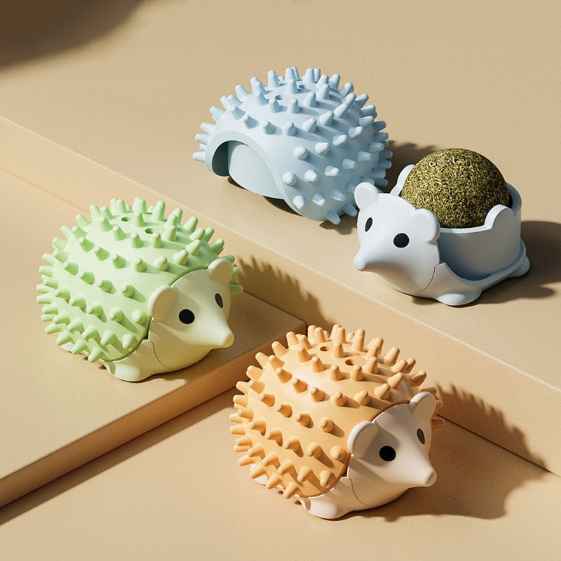 Cat self-grooming brushes shown in four colour options