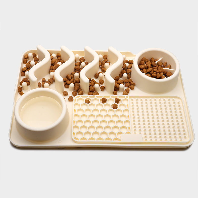 Textured pet lick mat with food portions on a white background
