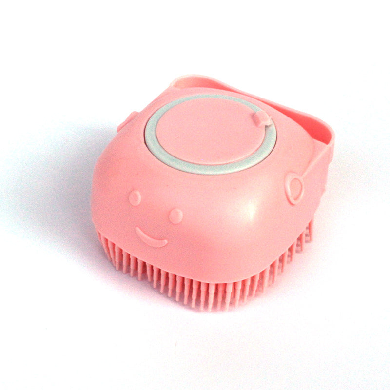 Pink silicone pet bath brush with a refillable shampoo chamber