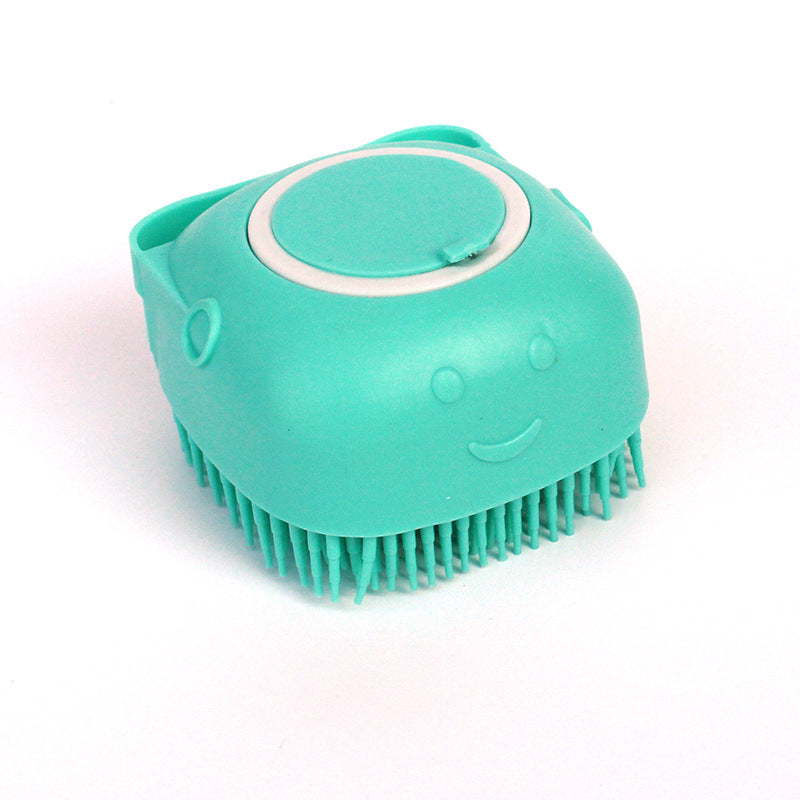 Green silicone pet bath brush on a clean white background