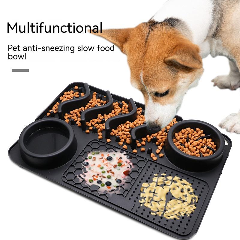 Dog eating from a textured slow-feeding lick mat